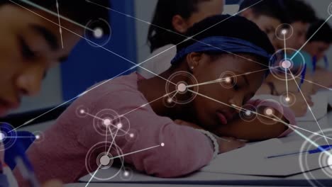 Animation-of-network-of-connections-moving-over-tired-schoolgirl-lying-on-desk-in-classroom