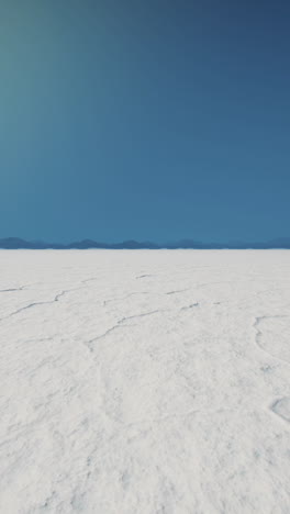 salt flat landscape under a clear blue sky