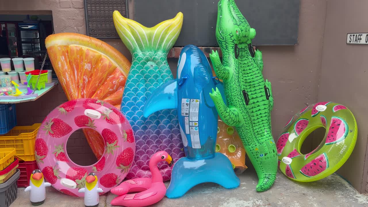 A row of Lilos outside a summer themed shop