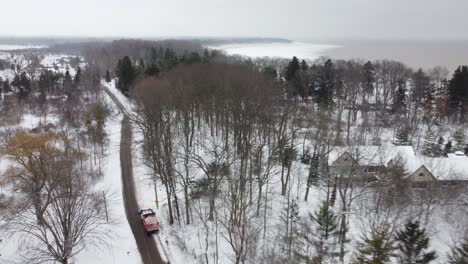 Areal-view-of-a-moving-grader-on-a-road,-Toronto,-Ontario,-Canada