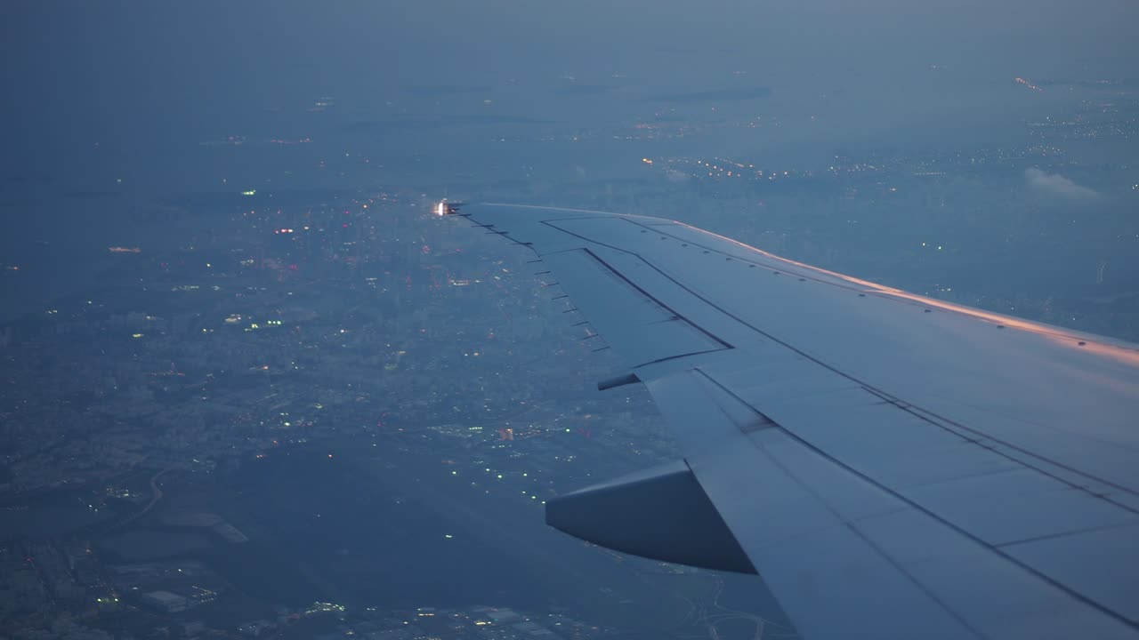 Night Flight over a City