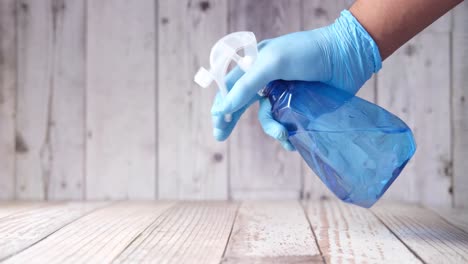 hand in glove cleaning with spray bottle