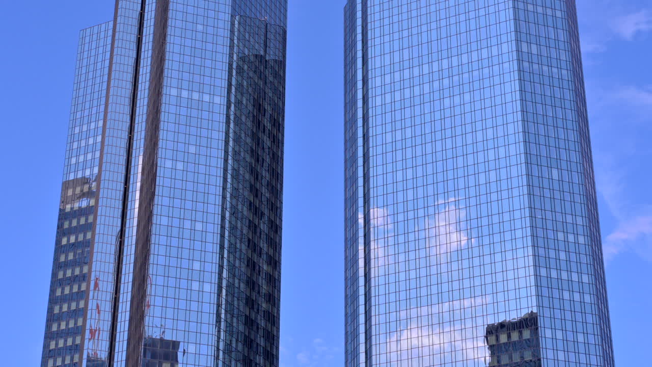 Frankfurt, Germany - November 13, 2022: Low angle view of the Deutsche Bank Twin Towers in Frankfurt, Germany