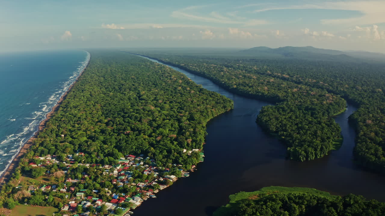 Aerial drone shot over Tortuguero National Park in Costa Rica.View of the River Canals and majestic Rainforest home to biodiversity and wildlife.