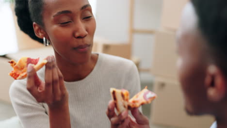 Couple-eating-pizza-and-talking-about-new-house