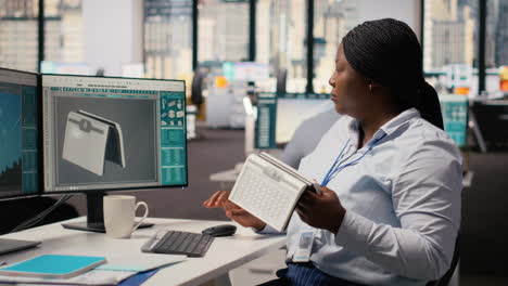 product developer in office using solar cell to create renewable energy device