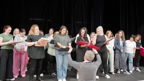 rehearsing cast, amateur drama group, artistic direction, stage show