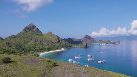 breathtaking komodo island beach bay in indonesia, establishing aerial landscape