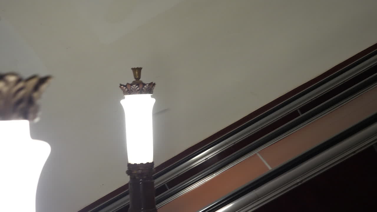 Moscow Metro escalator lights with people using station escalators