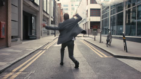 contemporary funky caucasian businessman street dancer dancing freestyle in the city