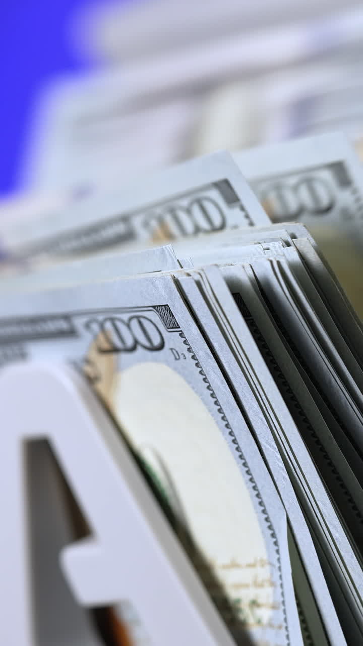 Financial process in bank. Counter machine for banking and commercial activity. Automatic calculates a large amount of dollar banknotes. Close-up. Vertical video