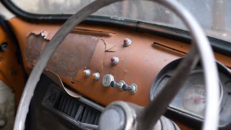 pull back shot from dashboard of old car, fiat 500, bangkok, thailand