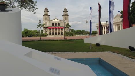 classic old cathedral revealed from central park in managua, nicaragua