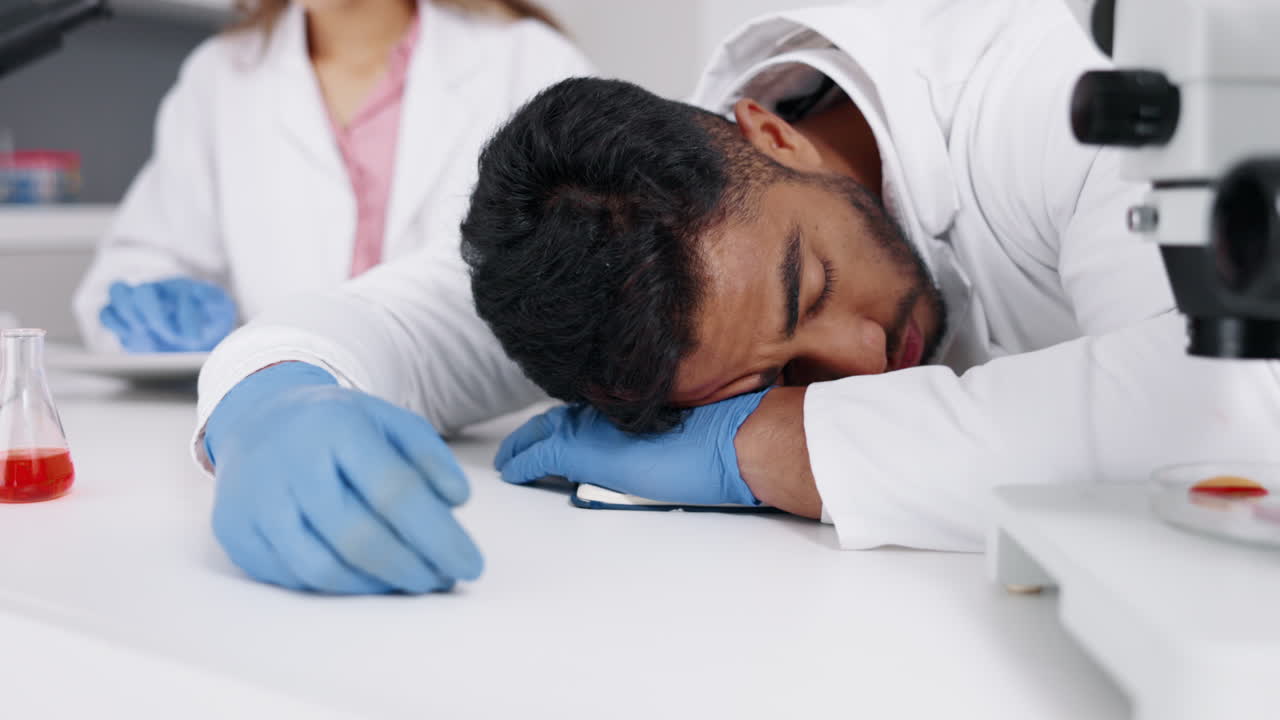 Scientist, sleep and man in laboratory