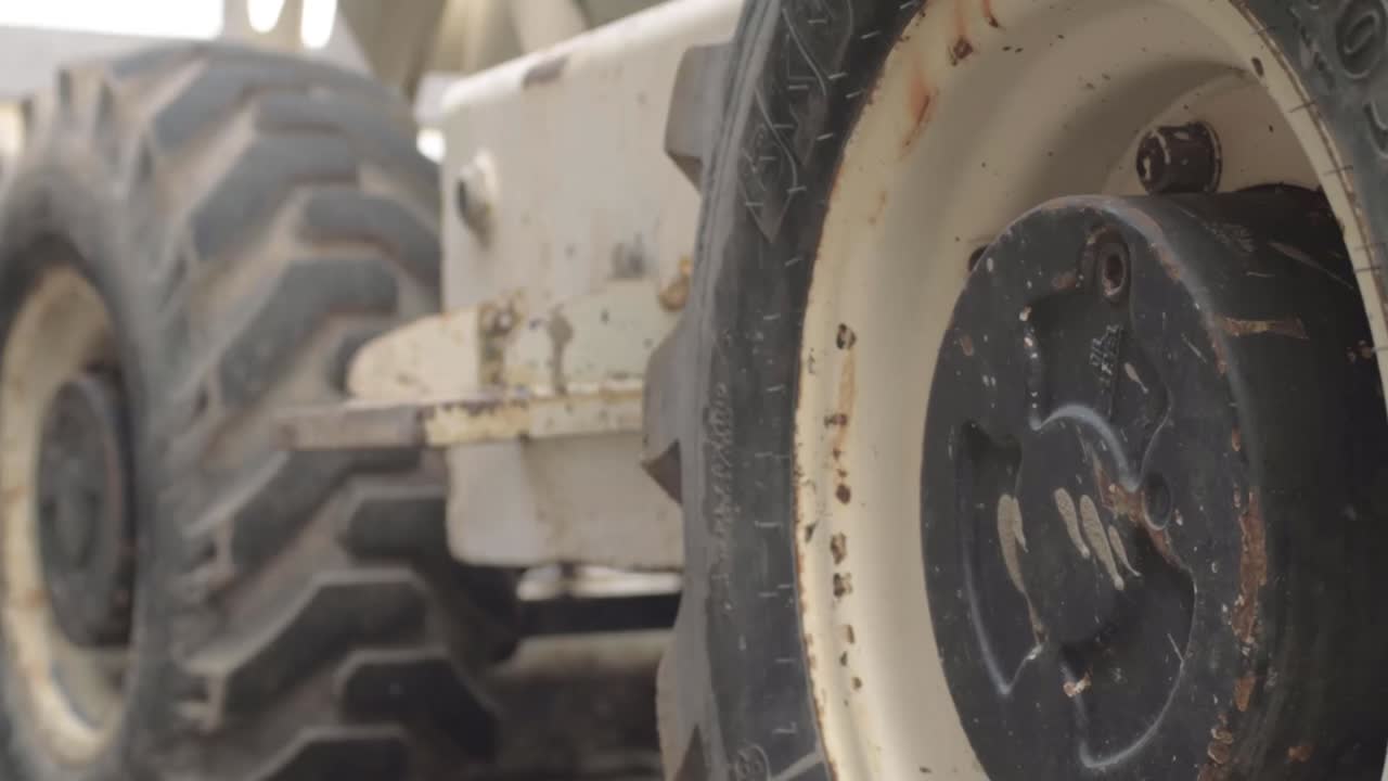 Tyres on heavy plant machine panning shot