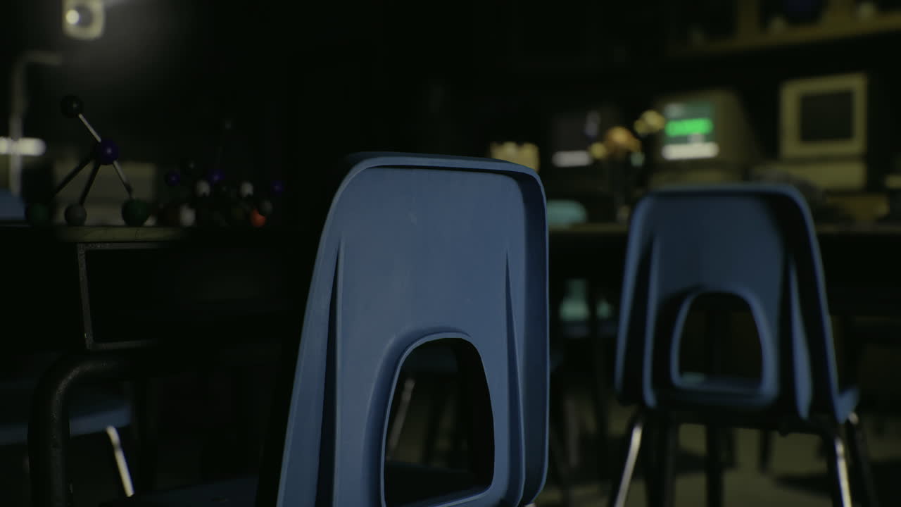 Students engage in a science lab activity in a dimly lit classroom space
