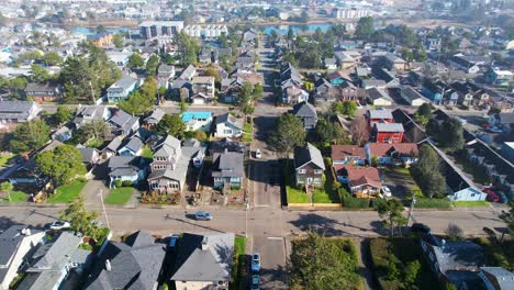 4k aerial drone shot floating over houses at seaside, oregon on a sunny day
