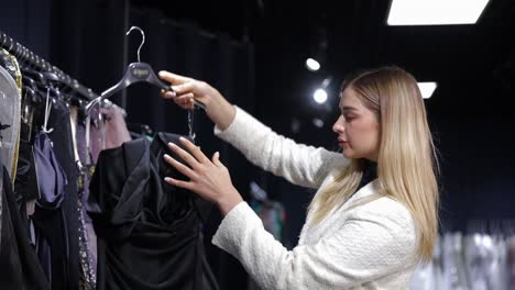 woman shopping for a dress in a boutique