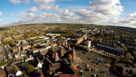 Aerial-footage,-view-of-the-famous-bottle-kilns-at-Gladstone-Pottery-Museum-in-Stoke-on-Trent,-Pottery-manufacturing,-industrial-decline-and-vacant-businesses