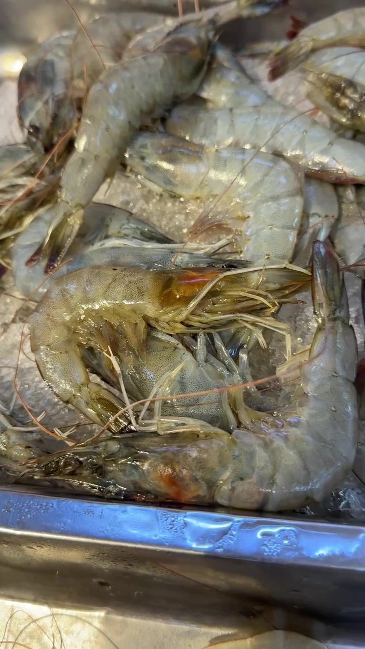 Fresh Raw Shrimp and Prawns on Ice at a Seafood Market