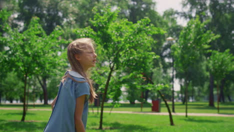 pretty girl playing badminton on nature close up. sporty child enjoy game.