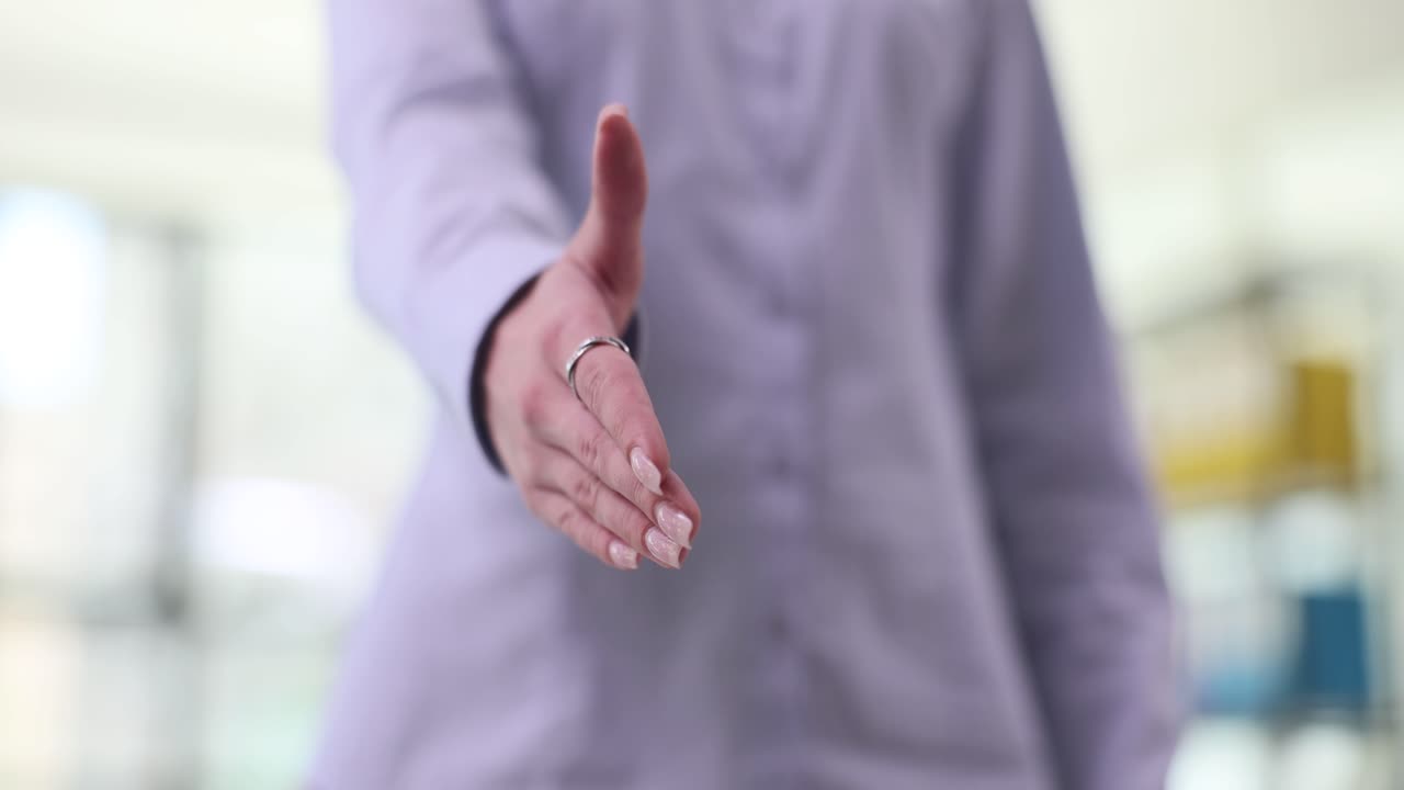 Close-up of a Business Person Offering a Handshake