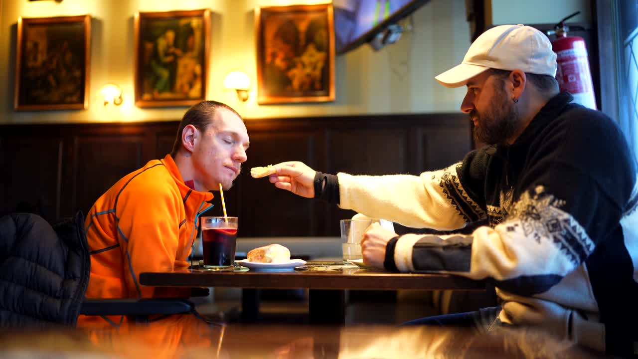 Two men sharing a meal