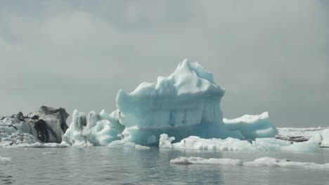 an iceberg floats by in iceland