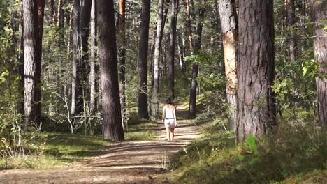 girl walking in the forest