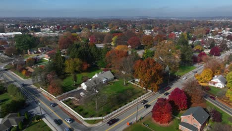 aerial of small town residential houses and homes in autumn