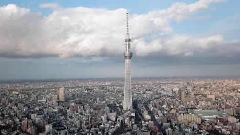 tokyo sky tree during a golden hour, drone ascending, 24 fps