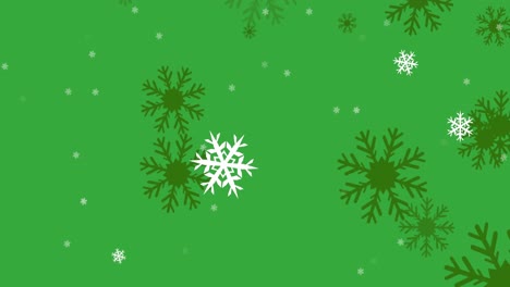 Animation-of-snowflakes-icons-falling-against-green-background-with-copy-space