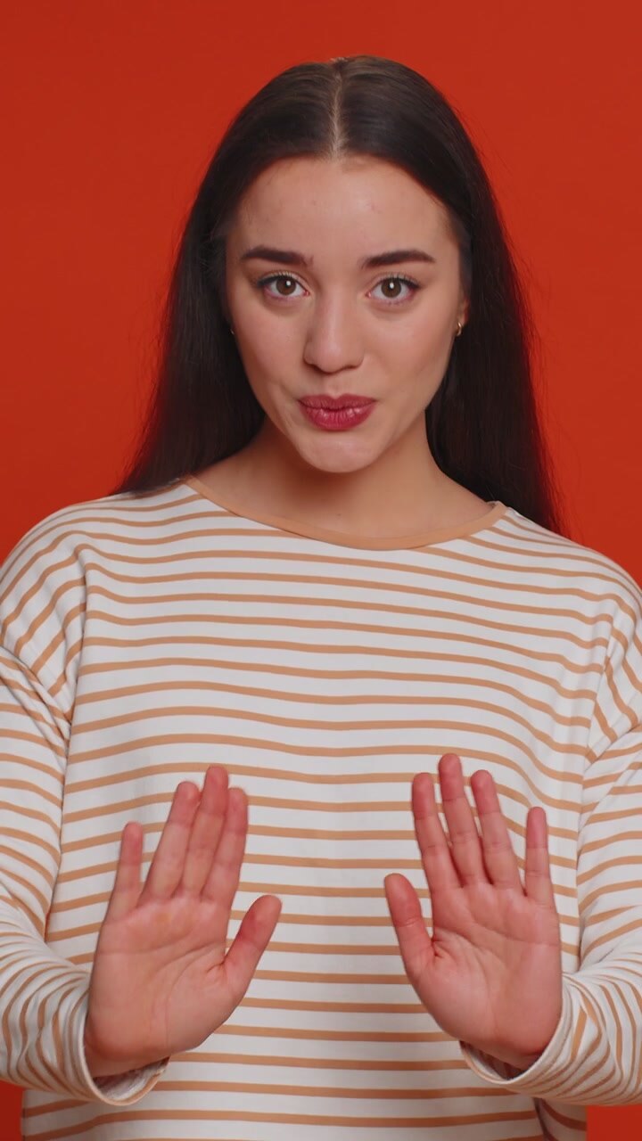 Young woman warning with admonishing finger gesture saying no be careful advice to avoid danger