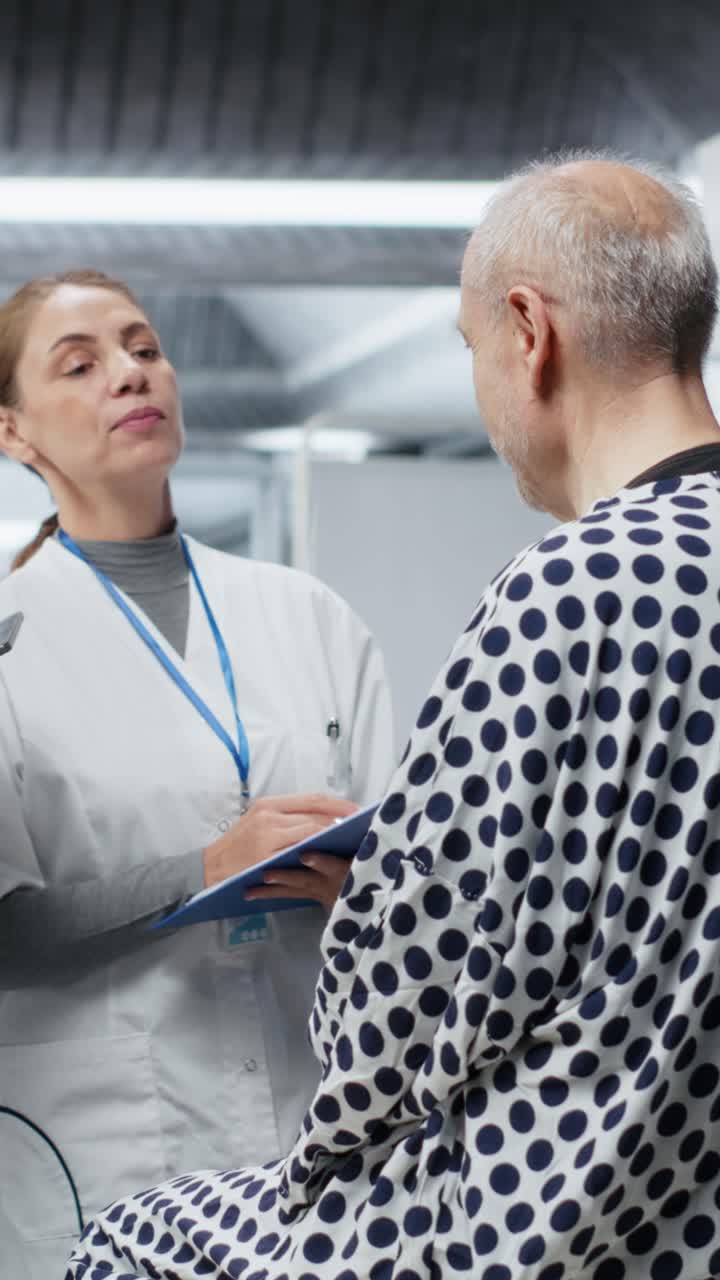 Vertical Video Doctors conducting observation of old man in a laboratory experiment