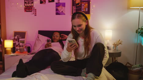 young couple laughing together in bed