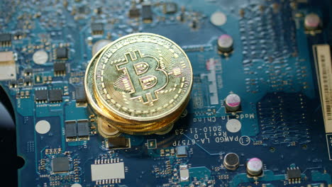 Modern-bitcoin-farm.-Gold-bit-coin-on-circuit-board