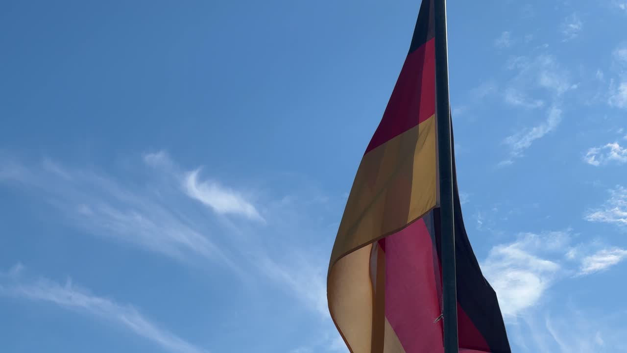 A German flag blowing in a light breeze outside a golf club in Cape Town.