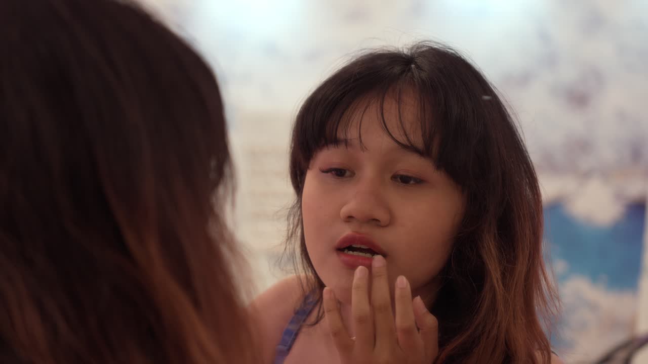 Portrait Of A Careless Smiling Woman In Front Of A Woman. Slow Motion Shot