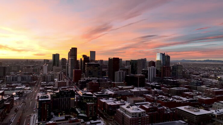 Denver City Skyline at morning sunrise aerial drone video moving from left to right with slight yaw