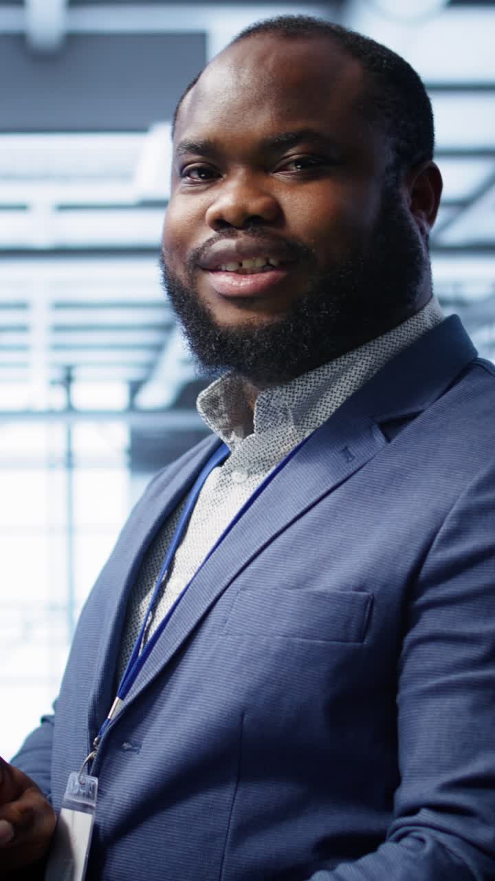 African American Man Working on Laptop in Data Center