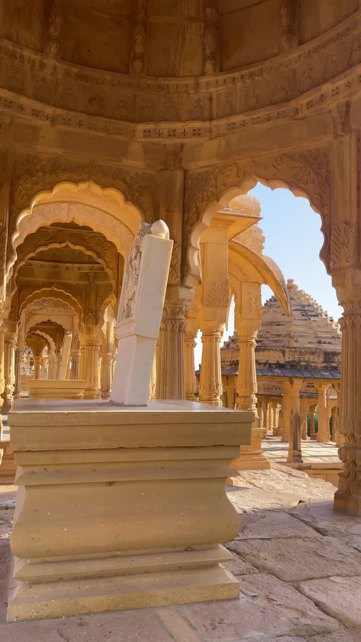 A close-up view of Jaisalmer's Bada Bagh on a bright desert day, where Rajasthan’s majestic architecture and stone carvings glow under the sunny sky India 4K