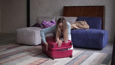 Woman-closing-and-zipping-suitcase,-getting-ready-for-road-trip-preparing-luggage-for-vacation