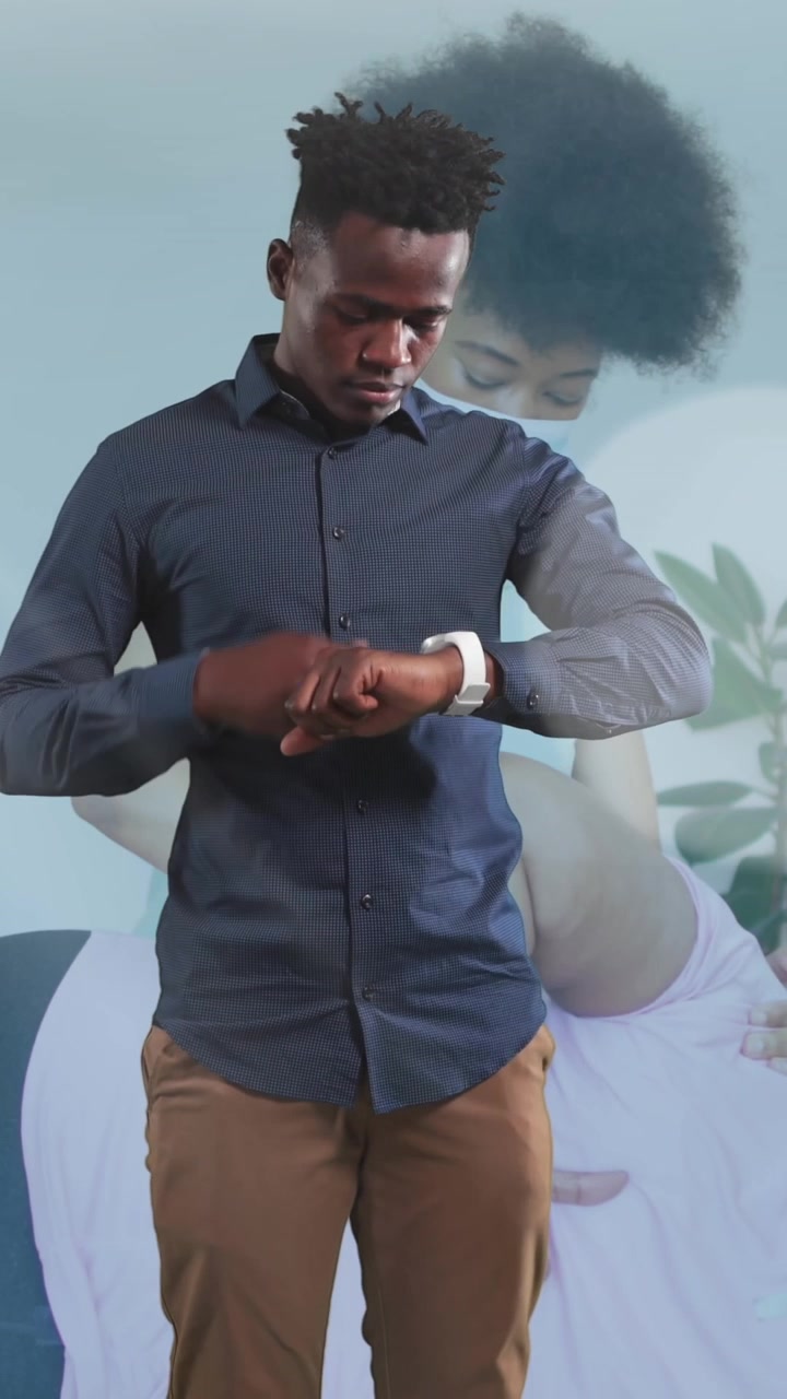 Animation of cup icon over african american man with smartwatch