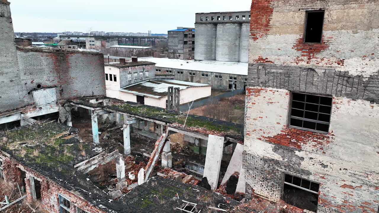 Wrecked buildings damaged by air bombing. Wartime consequences for the urban territory. Ruins after explosion.