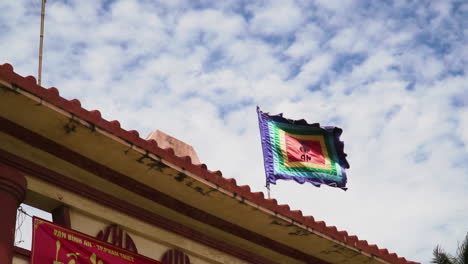 Slomo-shot-of-Whale-temple-flags-waving-in-wind,-Vietnam