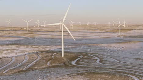 Aerial-shots-of-wind-turbines-on-a-cold-winter-afternoon-in-Calhan,-Colorado