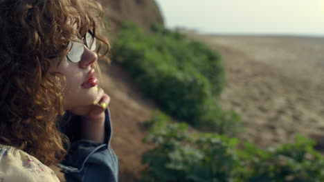 Side-view-attractive-girl-face-in-sunglasses-close-up.-Portrait-dreamy-woman.