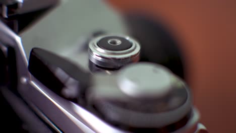 close up shot of old film slr camera shutter and winding know