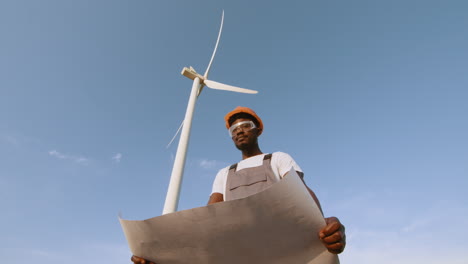 wind turbine engineer reviewing plans