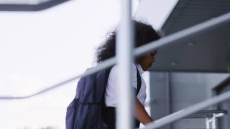 schoolgirl walking up stairs
